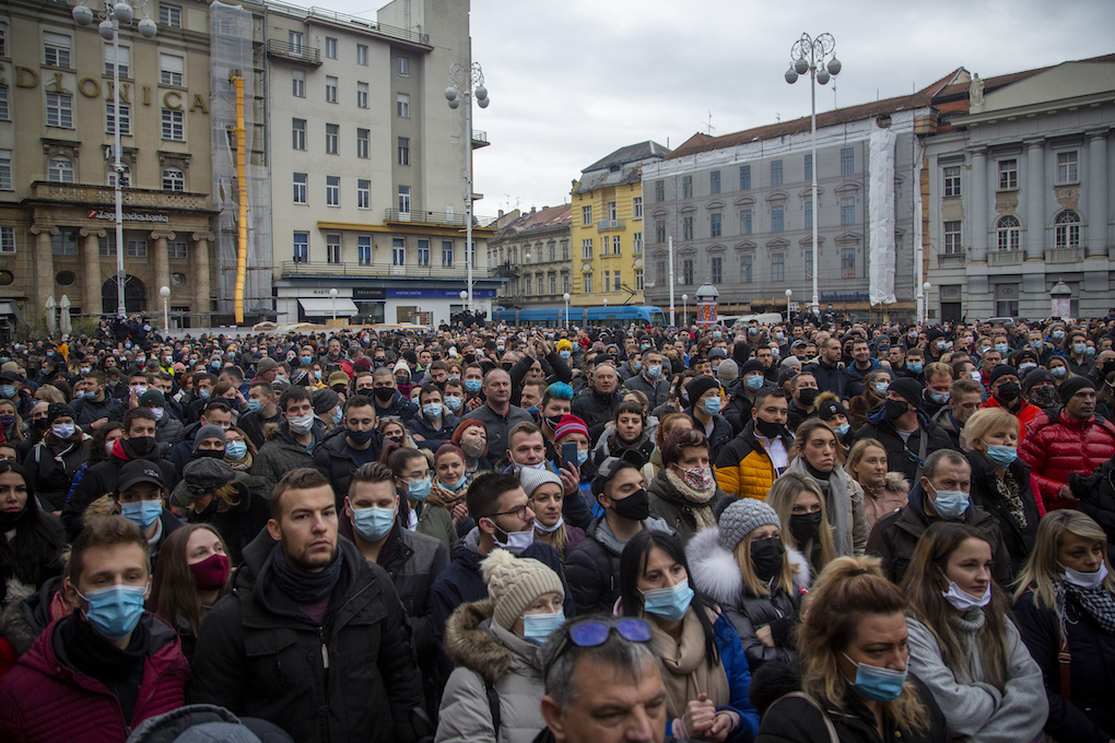 Several thousand owners of restaurants, bars and other businesses that have been shut down during the coronavirus pandemic rally against the government measures in Zagreb, Croatia, Wednesday, Feb. 3, 2021. The protests was organized by an association of entrepreneurs who are demanding that they be allowed to work while respecting the anti-virus rules. (AP Photo/Darko Bandic)