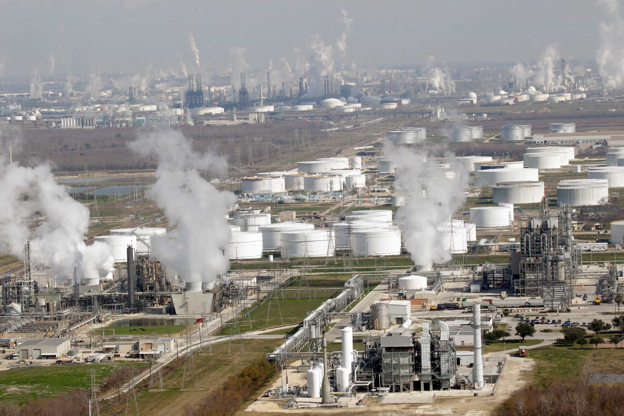 FILE - In this Nov. 10, 2010 file photo, petrochemical plants and refineries are shown in this aerial view, in Deer Park, Texas. Three commissioners appointed by Gov. Rick Perry may grant some of the nation's largest refineries a tax refund of more than $135 million. (AP Photo/David J. Phillip, File)