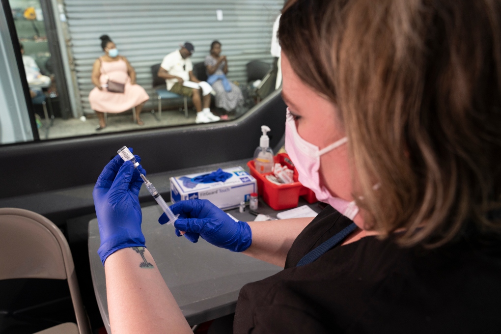 A nurse administers COVID vaccines from a van in the Bronx, July 20, 2021. Breakthrough COVID infections in vaccinated people are still relatively uncommon, experts say, and those that cause serious illness, hospitalization or death even more so. (James Estrin/The New York Times)